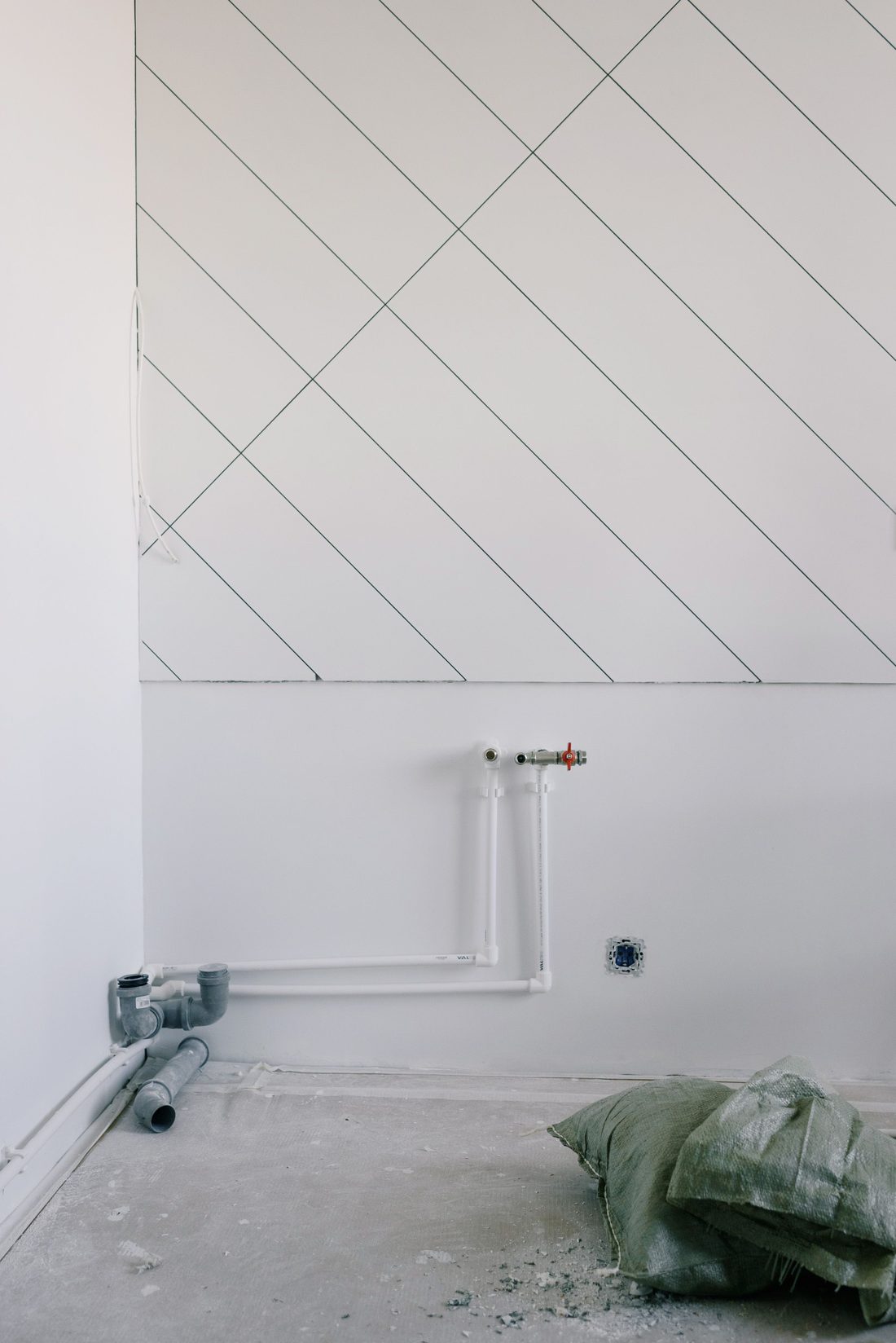 Exposed wall plumbing during a renovation