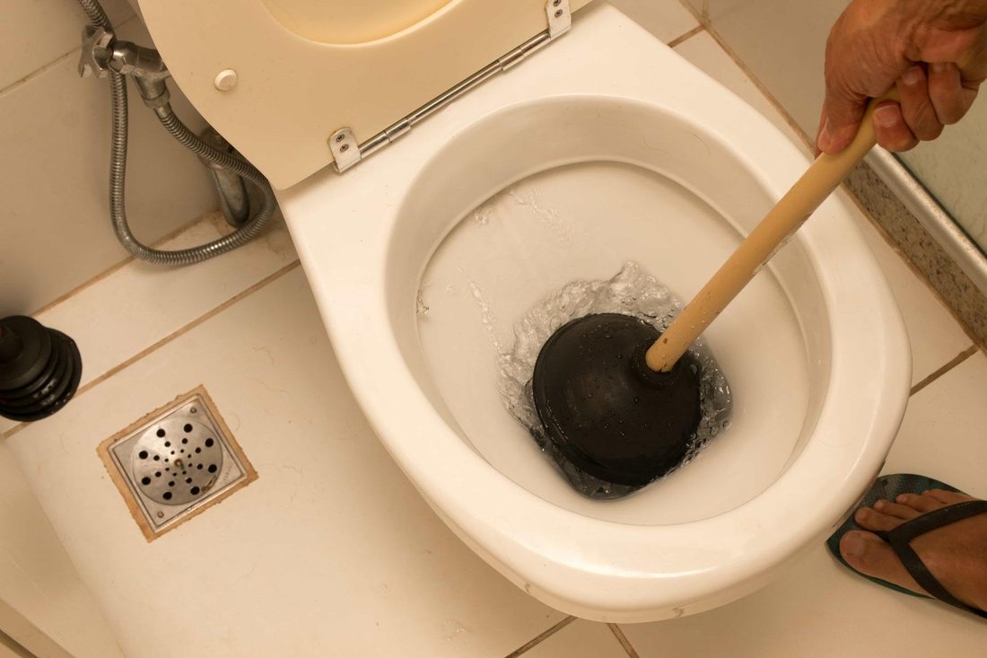 Unclogging a toilet