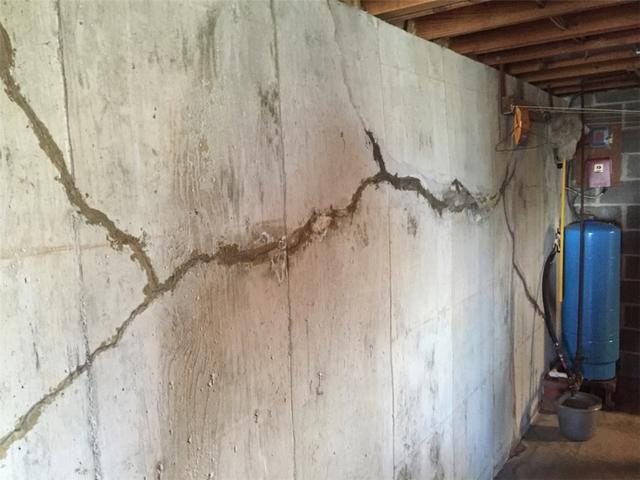 A large crack in a basement foundation wall