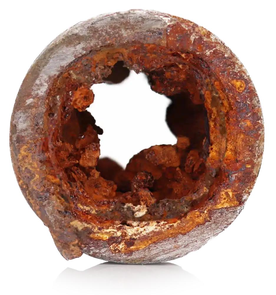 A cutaway of a galvanized steel pipe clogged with internal rust corrosion