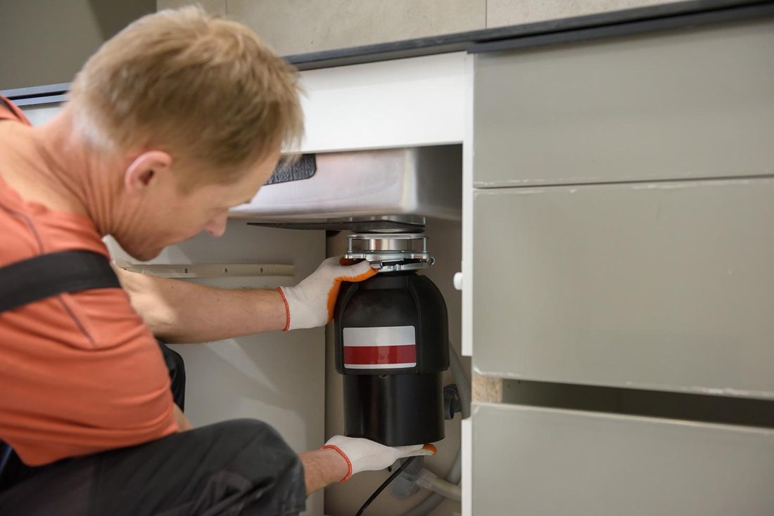 Garbage disposal under a kitchen sink
