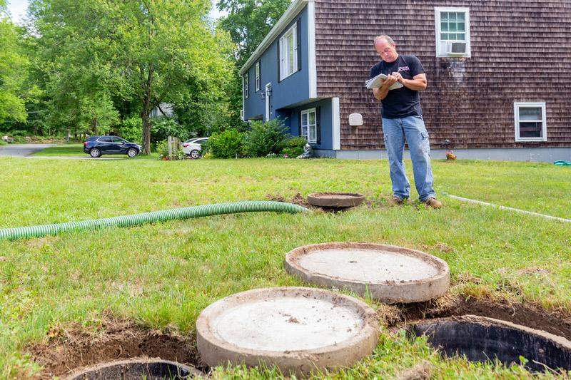 A septic system being inspected in a Massachusetts yard